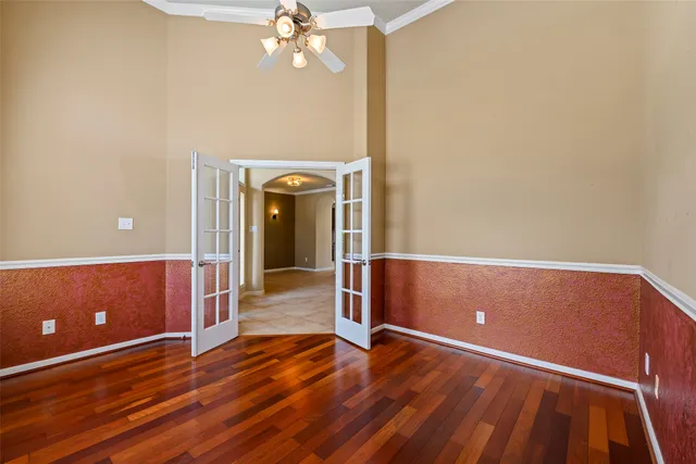 a view of room with window and wooden floor