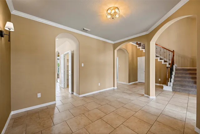 a view of a hallway with wooden shelves