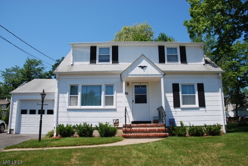 88 Rosedale Avenue Madison, NJ 07940 - Photo 1 of 10 a front view of a house with a yard