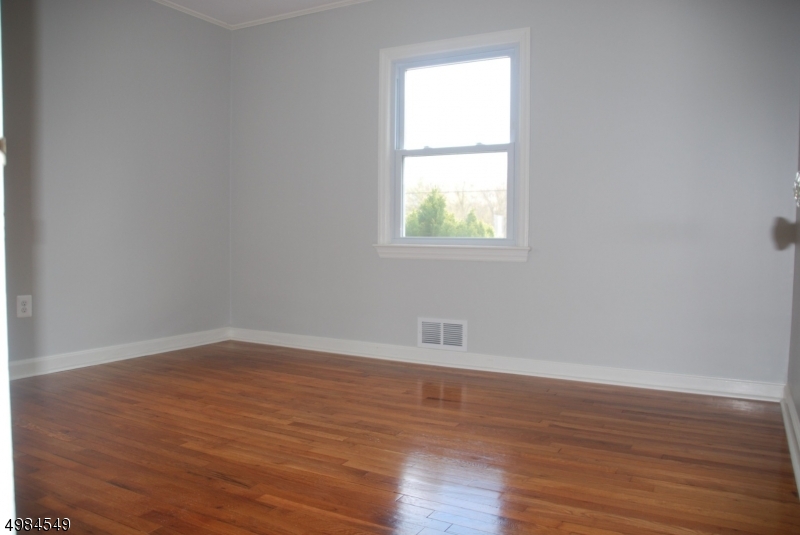 88 Rosedale Avenue Madison, NJ 07940 - Photo 8 of 10 an empty room with wooden floor and a window