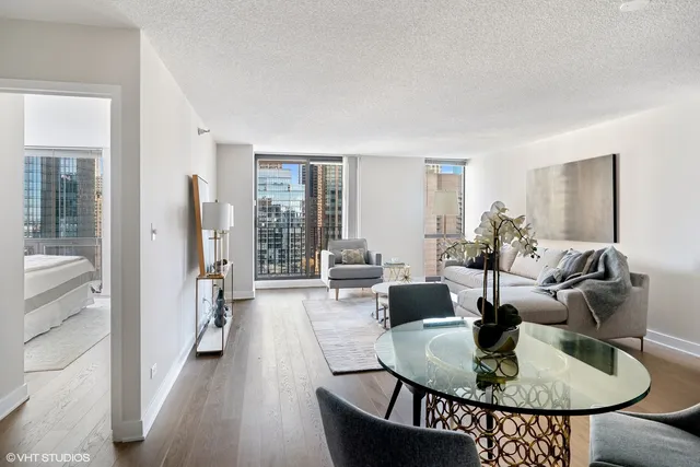 a living room with furniture and a table