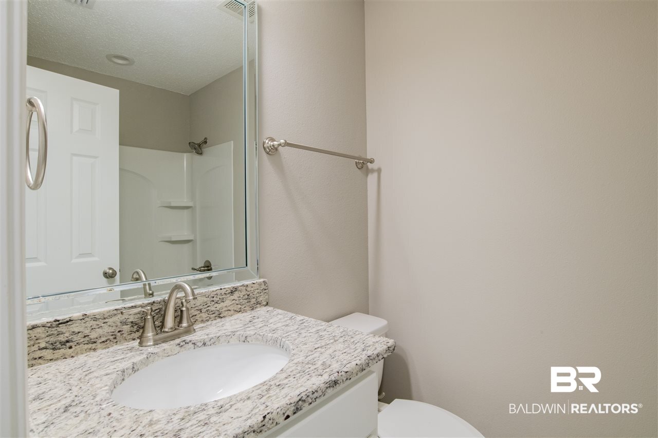 9141 Semmes Court Semmes, AL 36575 - Photo 20 of 28 Guest bath with easy access from guest bedrooms.
