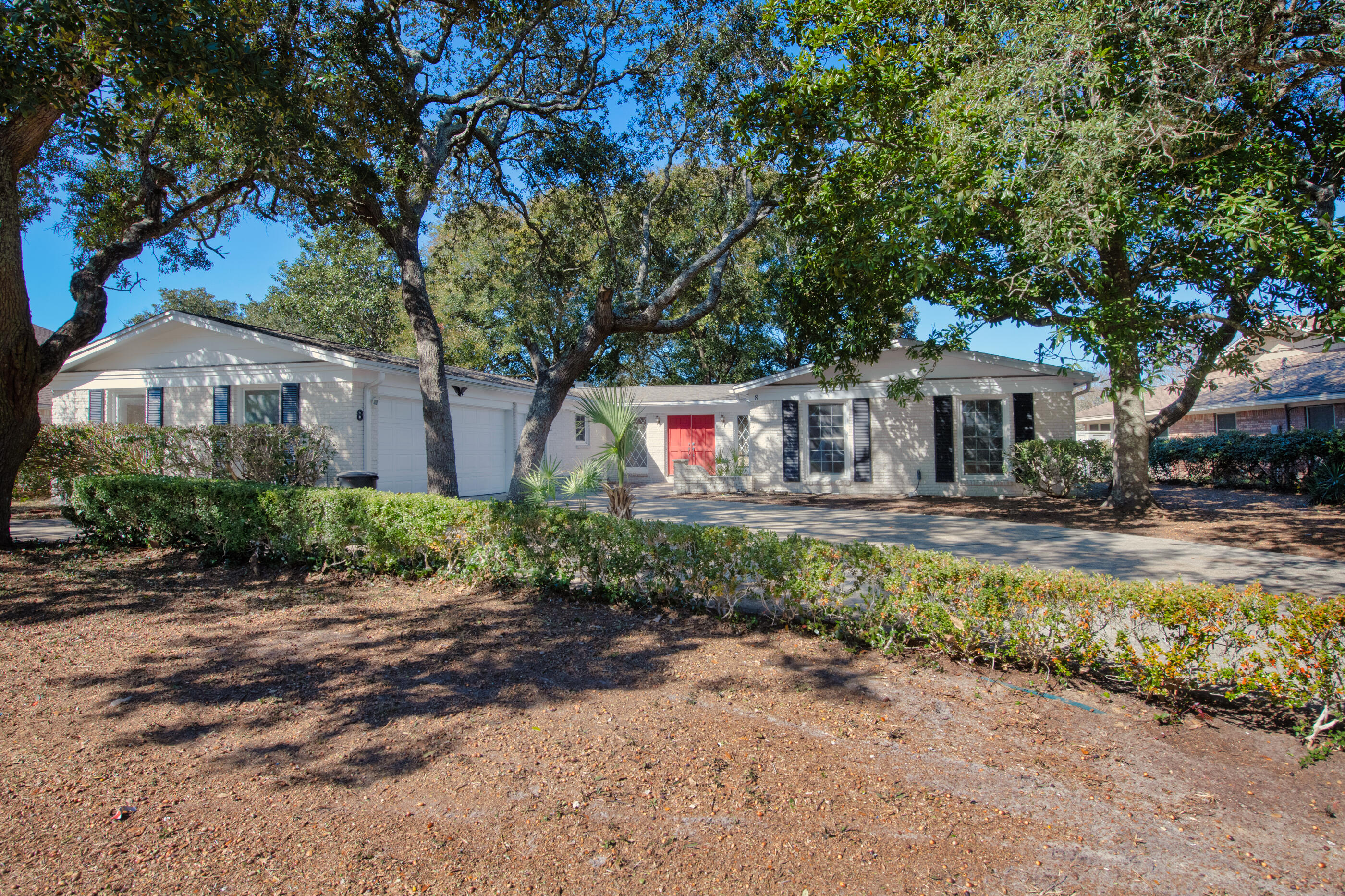 8 Country Club Road Shalimar, FL 32579 - Photo 1 of 1 a front view of a house with a yard