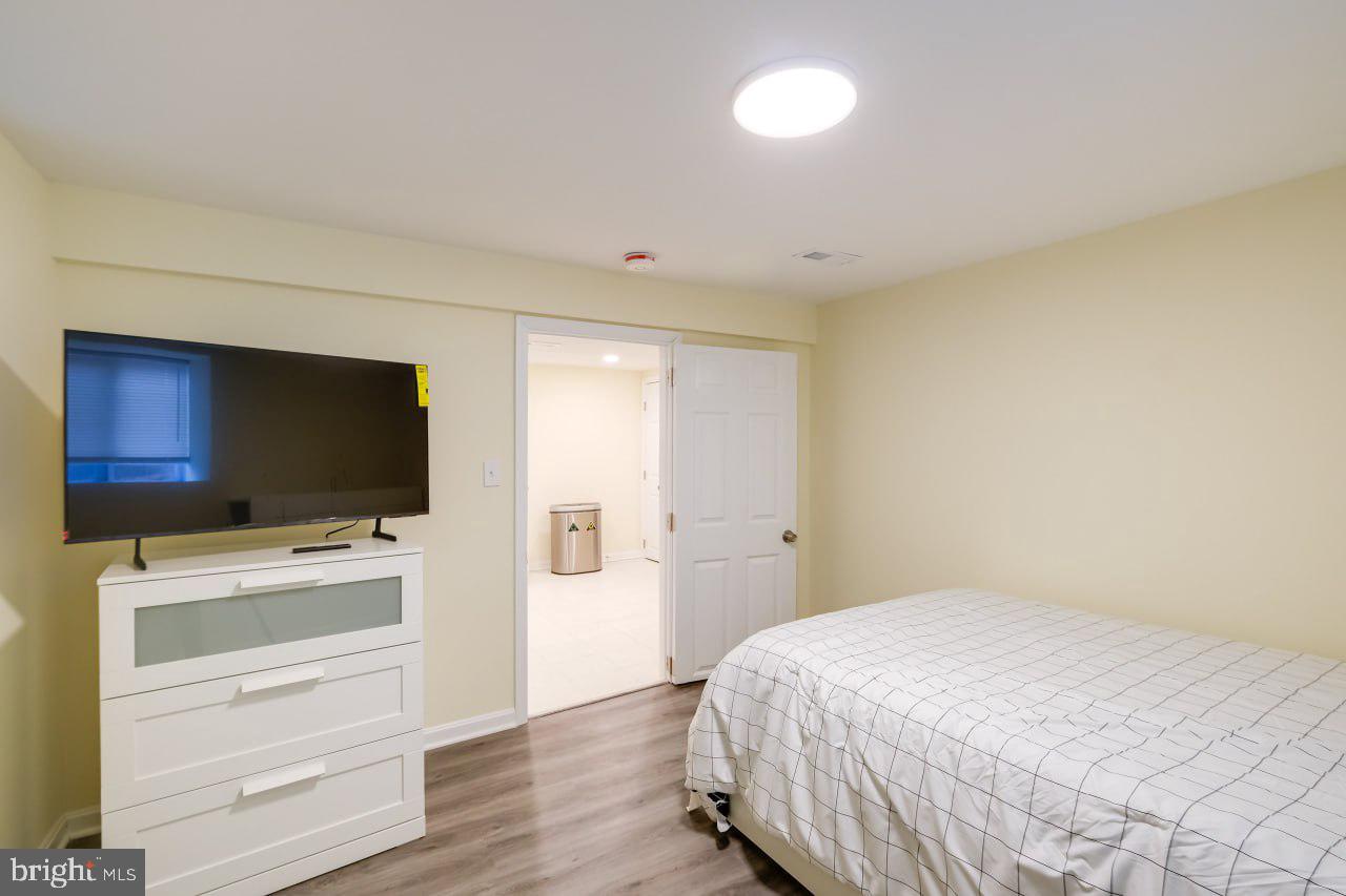 3312 Clay Street Silver Spring, MD 20902 - Photo 7 of 19 a bedroom with a bed and flat screen tv