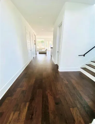 a kitchen with a table chairs stove and cabinets