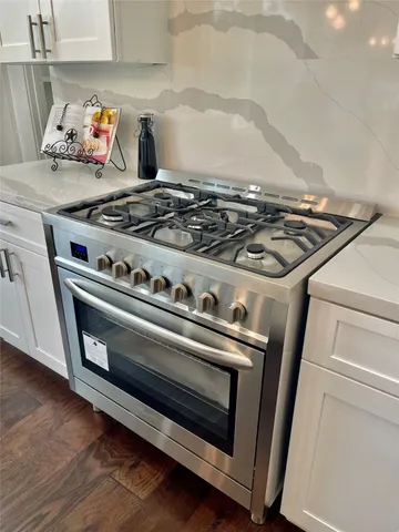 a bathroom with a double vanity sink toilet and shower