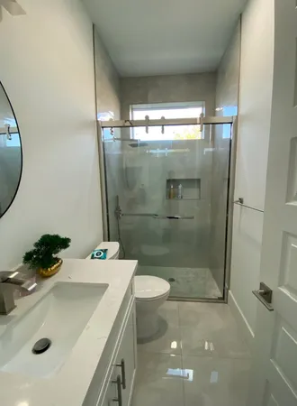 a view of a living room kitchen and a sink