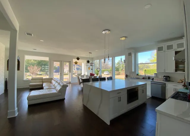 a front view of a house with a big yard