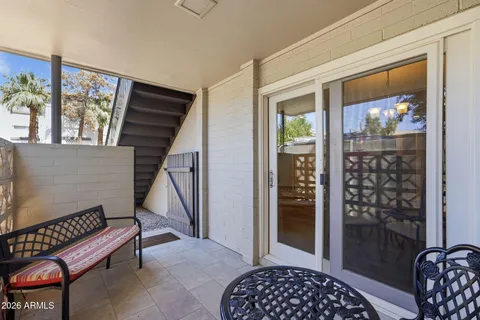 a view of entryway with wooden floor and door