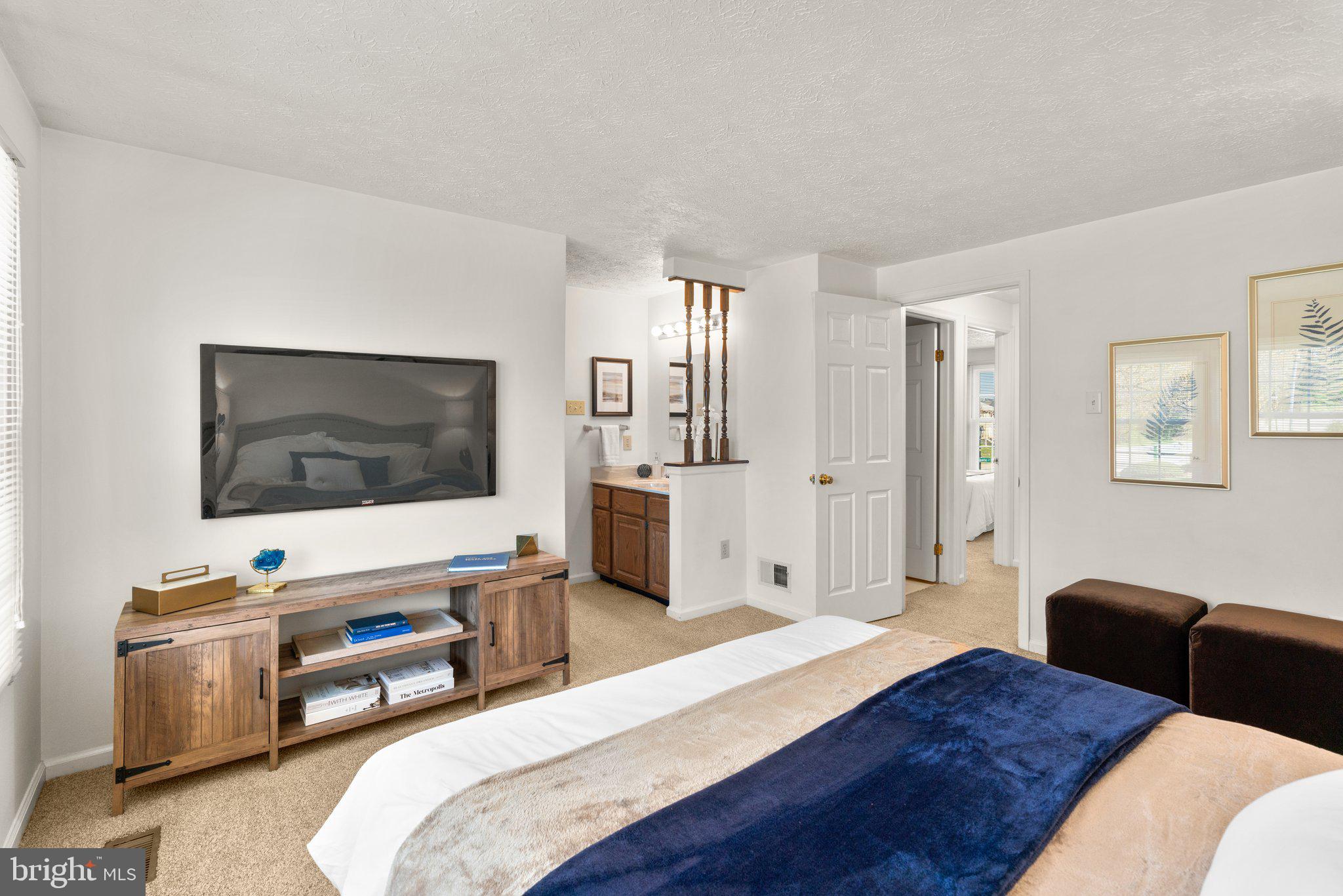 2 Ramsgate Court Halethorpe, MD 21227 - Photo 13 of 30 a bedroom with a bed and a flat screen tv