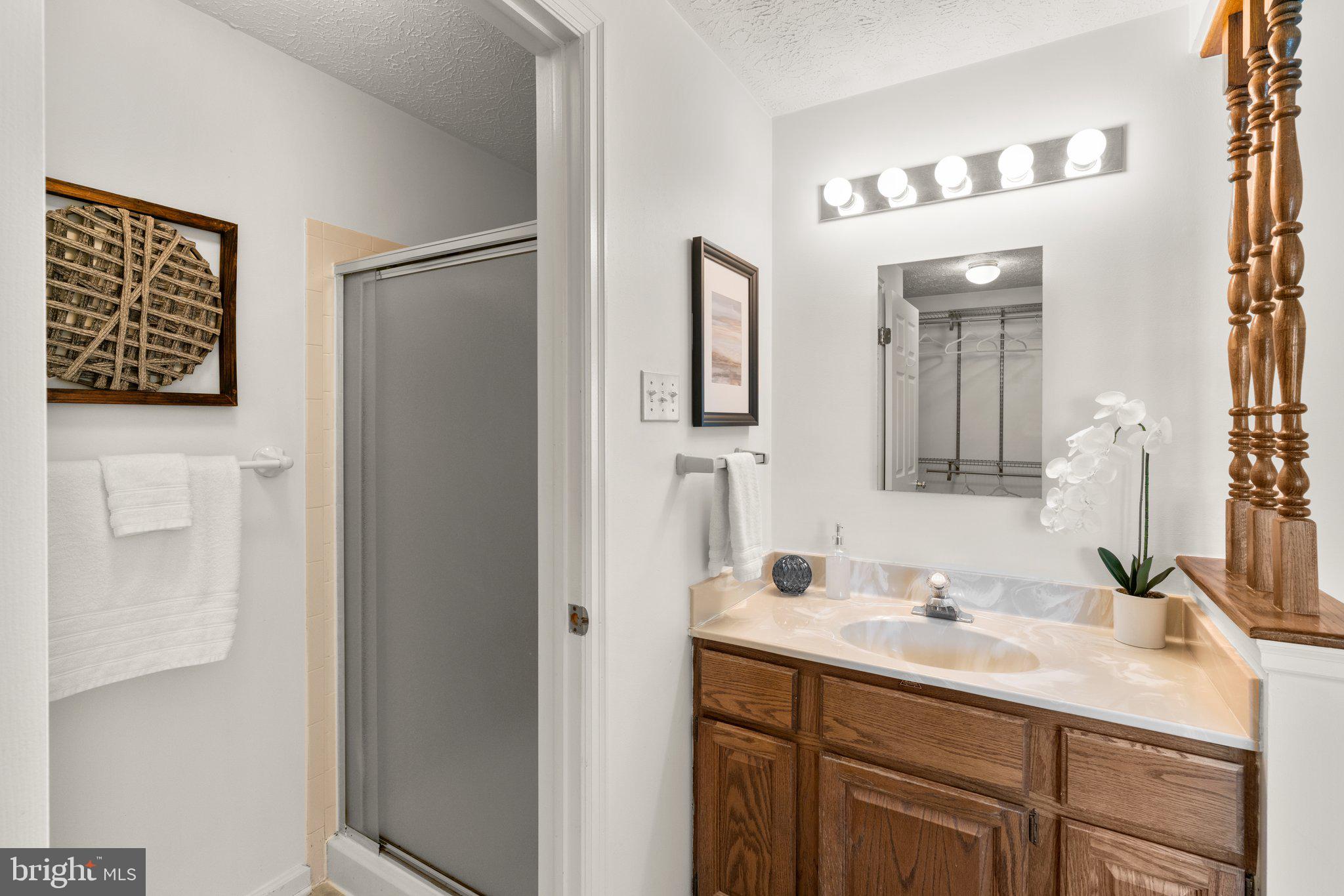 2 Ramsgate Court Halethorpe, MD 21227 - Photo 14 of 30 a bathroom with a sink vanity and a mirror