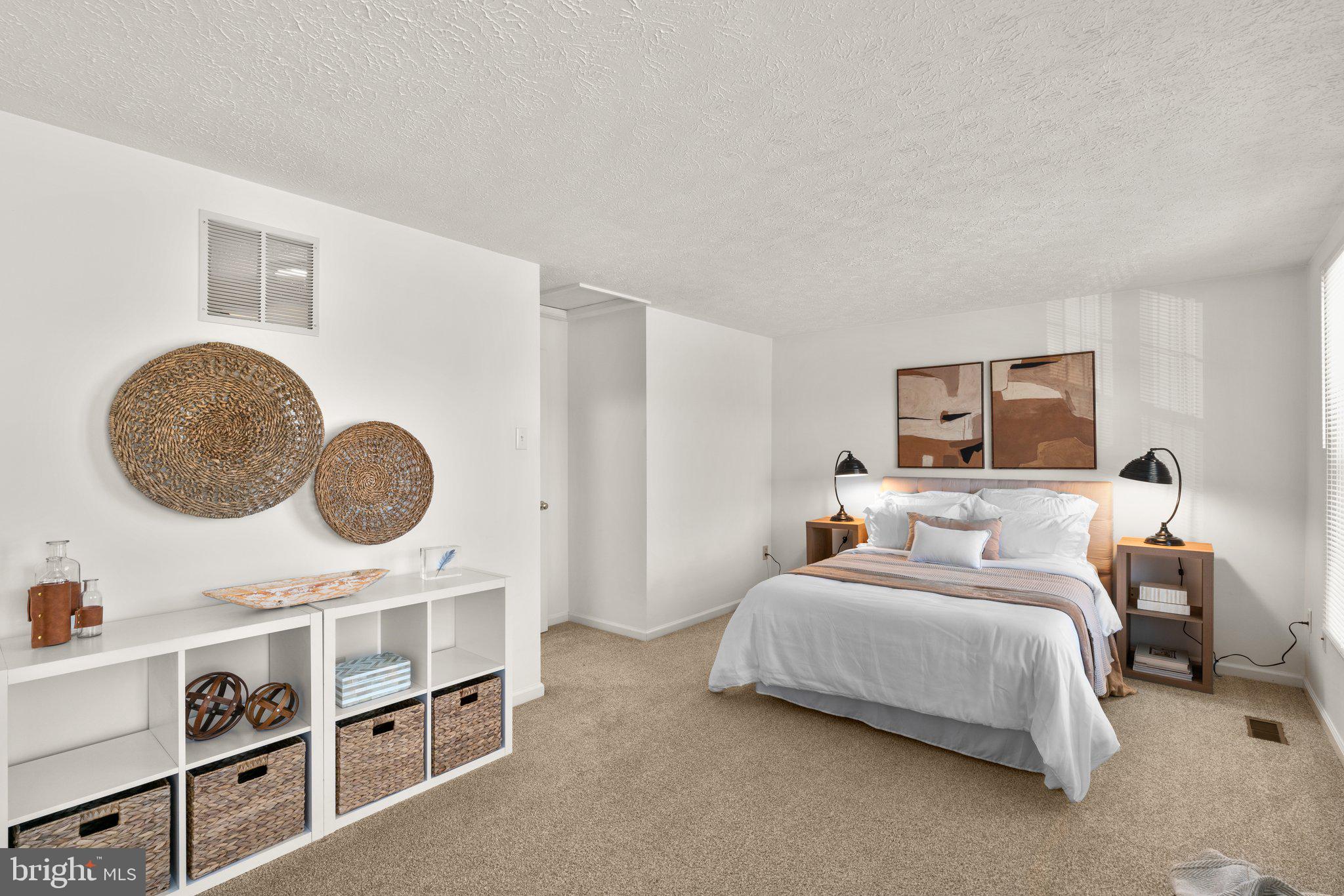 2 Ramsgate Court Halethorpe, MD 21227 - Photo 15 of 30 a bedroom with a bed a mirror and a potted plant