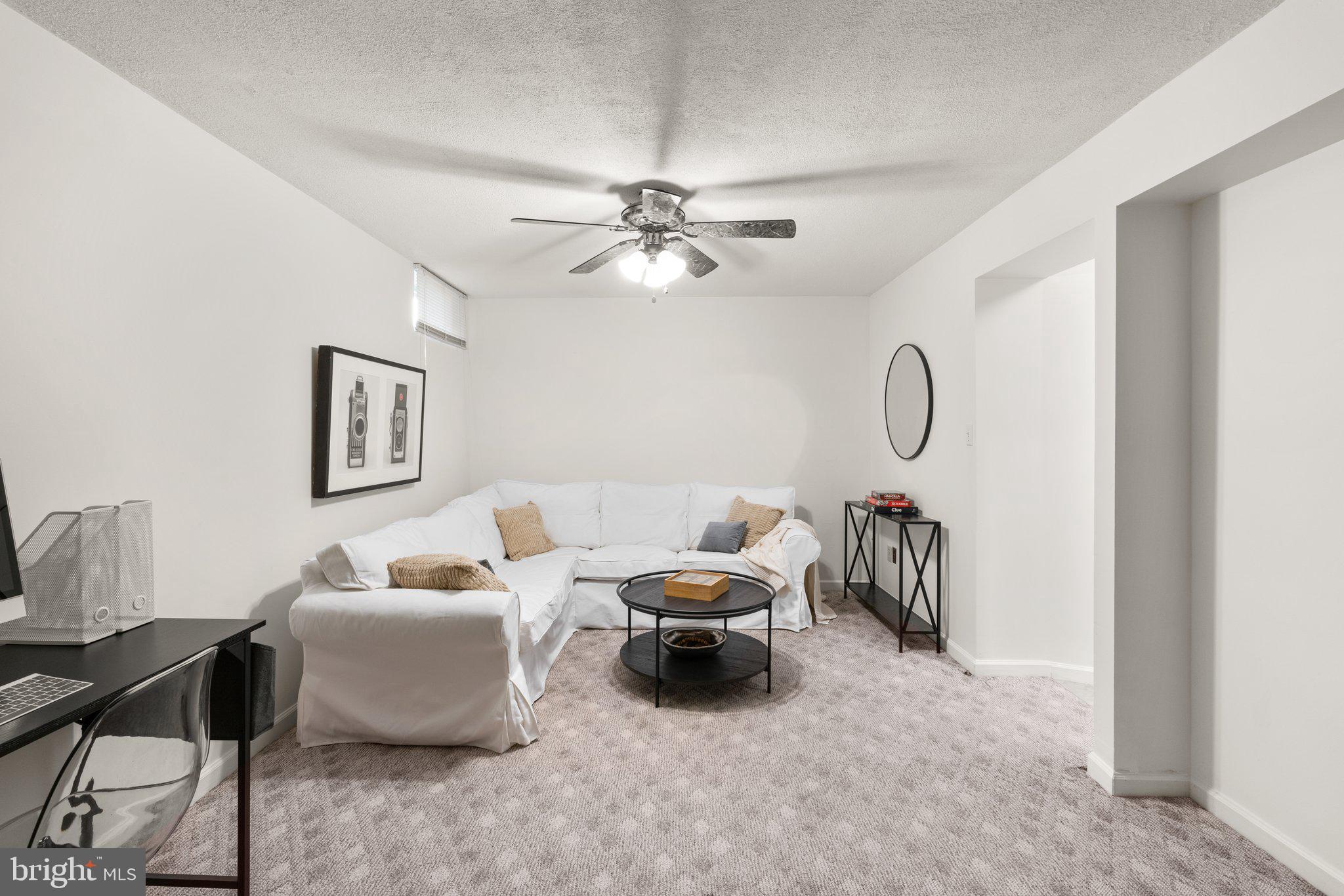 2 Ramsgate Court Halethorpe, MD 21227 - Photo 21 of 30 a living room with furniture and a chandelier fan