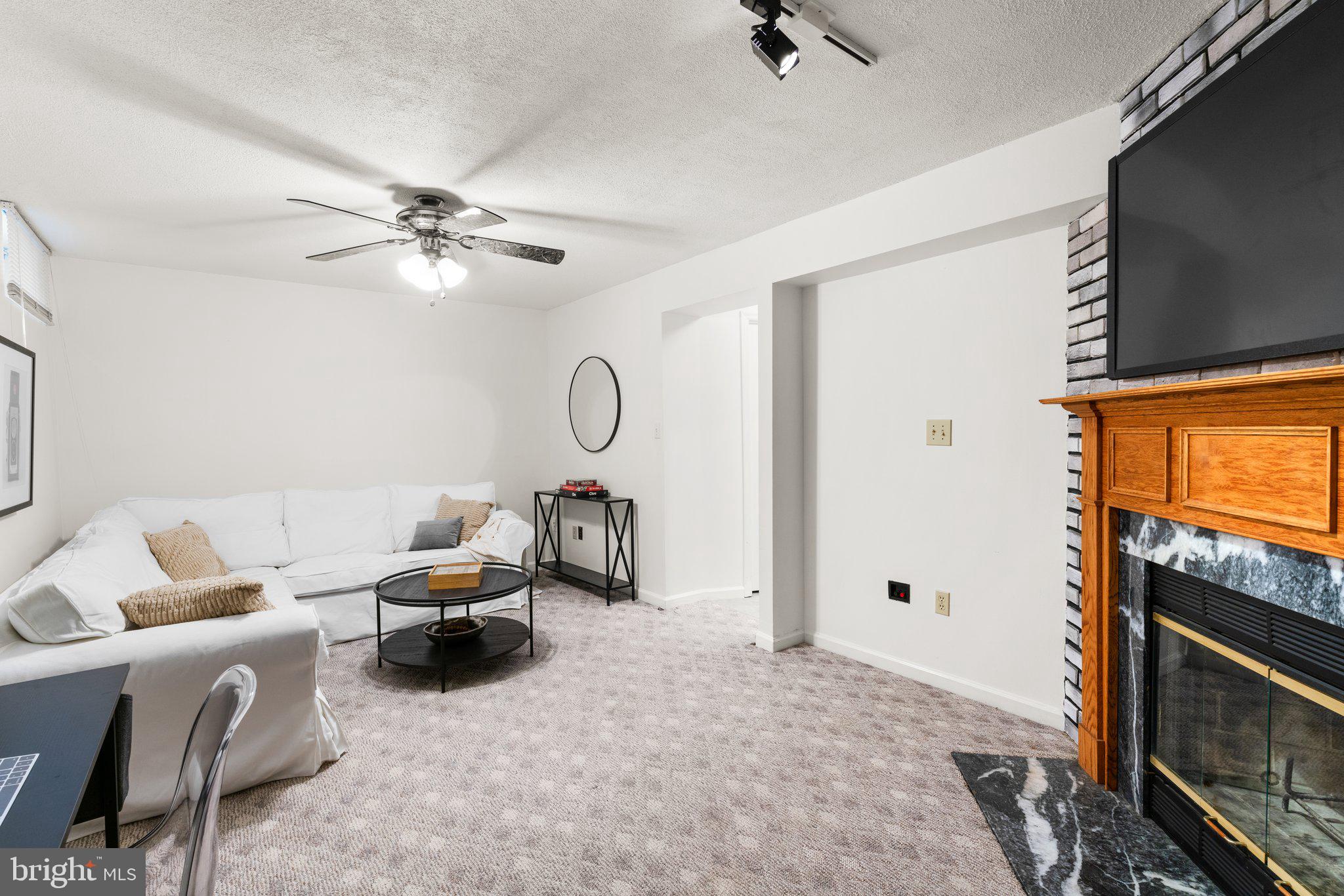 2 Ramsgate Court Halethorpe, MD 21227 - Photo 22 of 30 a living room with furniture a flat screen tv and a window