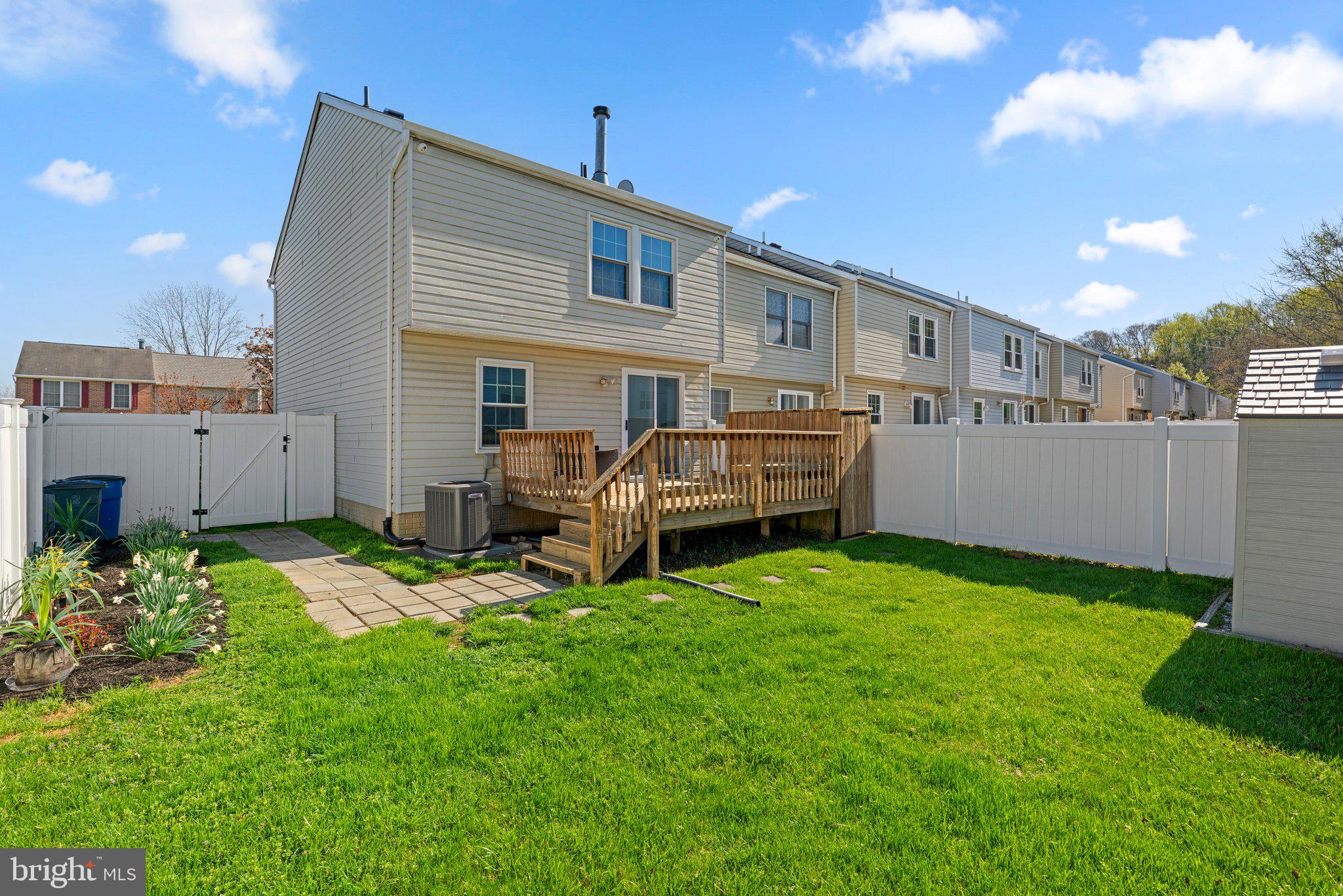 2 Ramsgate Court Halethorpe, MD 21227 - Photo 26 of 30 a backyard of a house with barbeque oven and outdoor seating