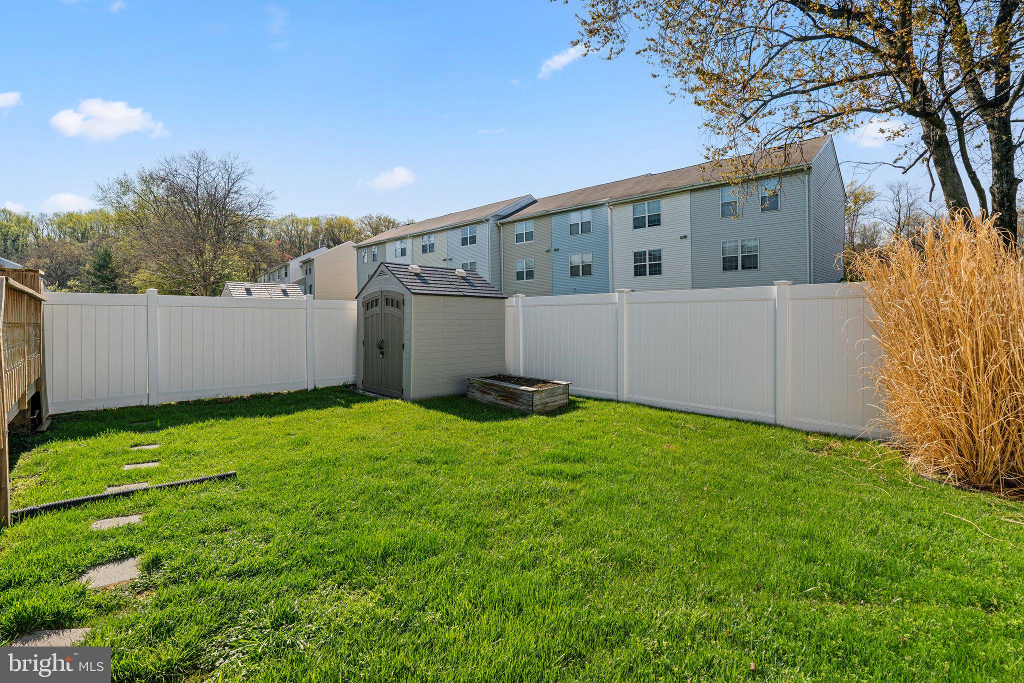 2 Ramsgate Court Halethorpe, MD 21227 - Photo 29 of 30 a backyard of a house with plants and tree