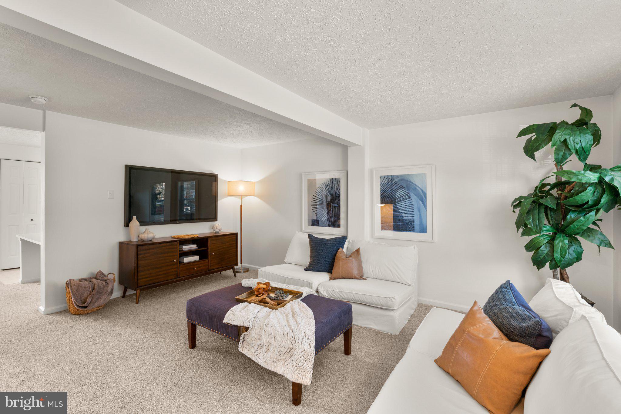 2 Ramsgate Court Halethorpe, MD 21227 - Photo 4 of 30 a living room with furniture and a flat screen tv