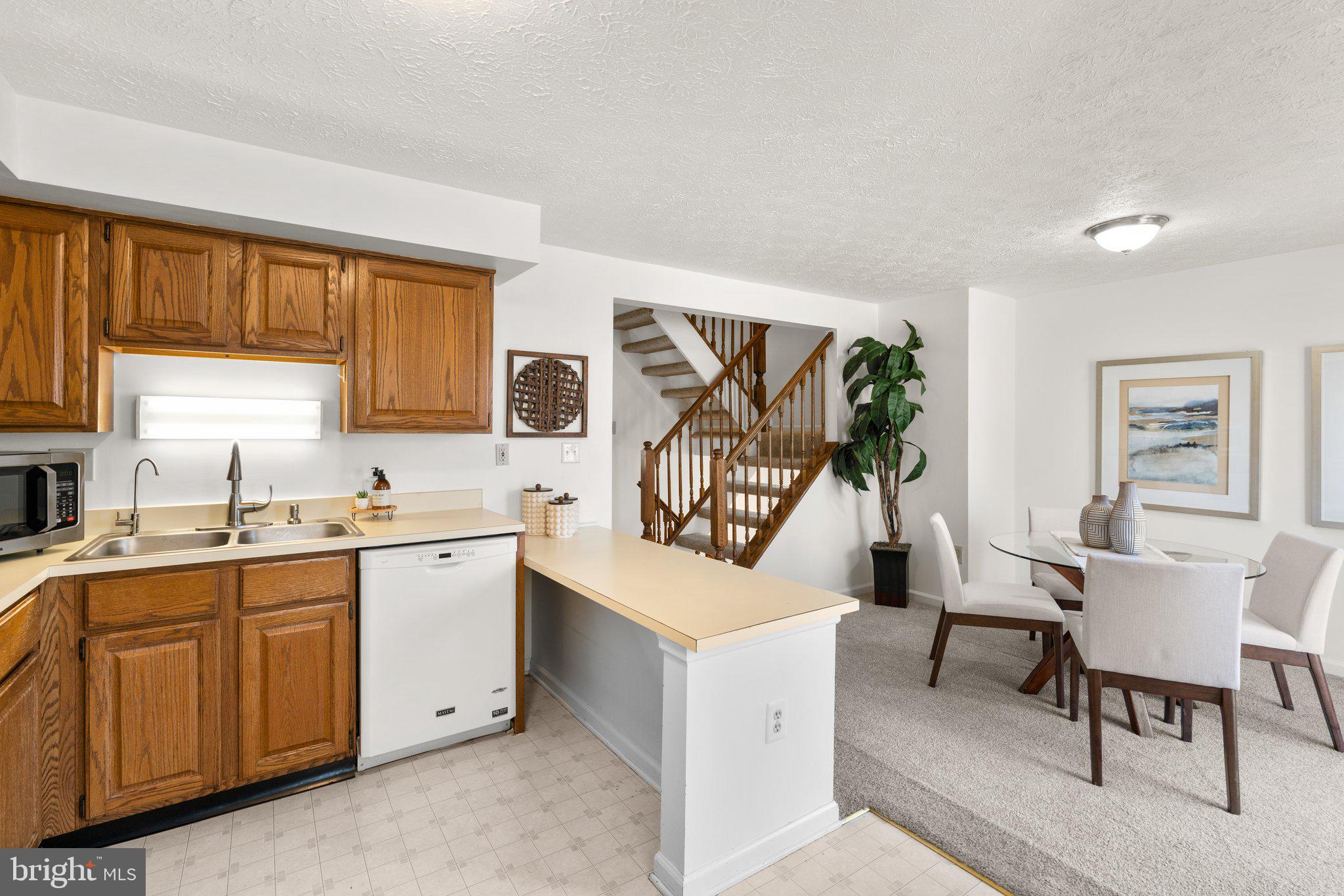 2 Ramsgate Court Halethorpe, MD 21227 - Photo 8 of 30 a view of a kitchen with fridge and workspace