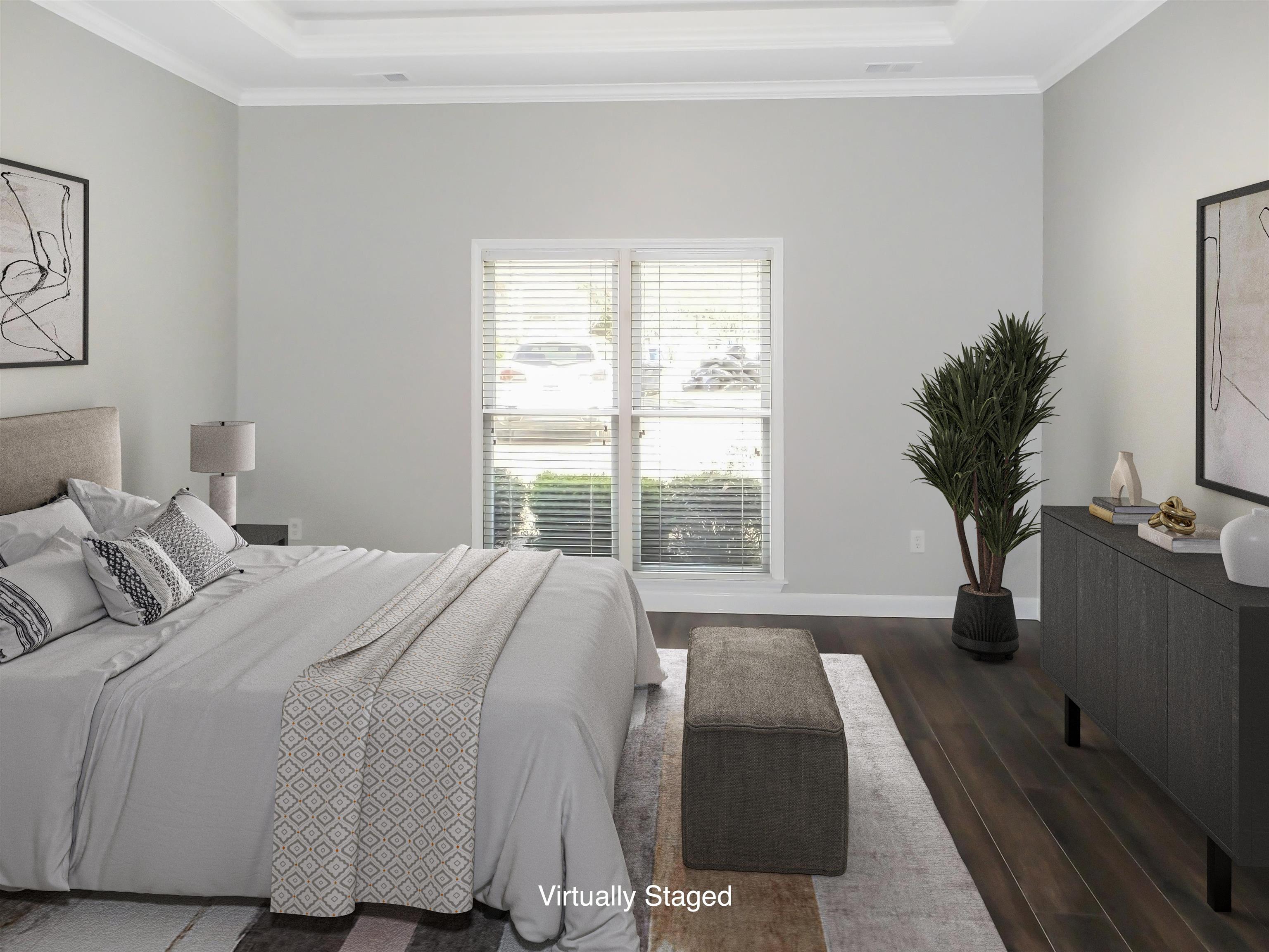 4323 Country Bridge Road Lakeland, TN 38002 - Photo 21 of 35 Bedroom with a raised ceiling, dark wood-style flooring, ornamental molding, and baseboards