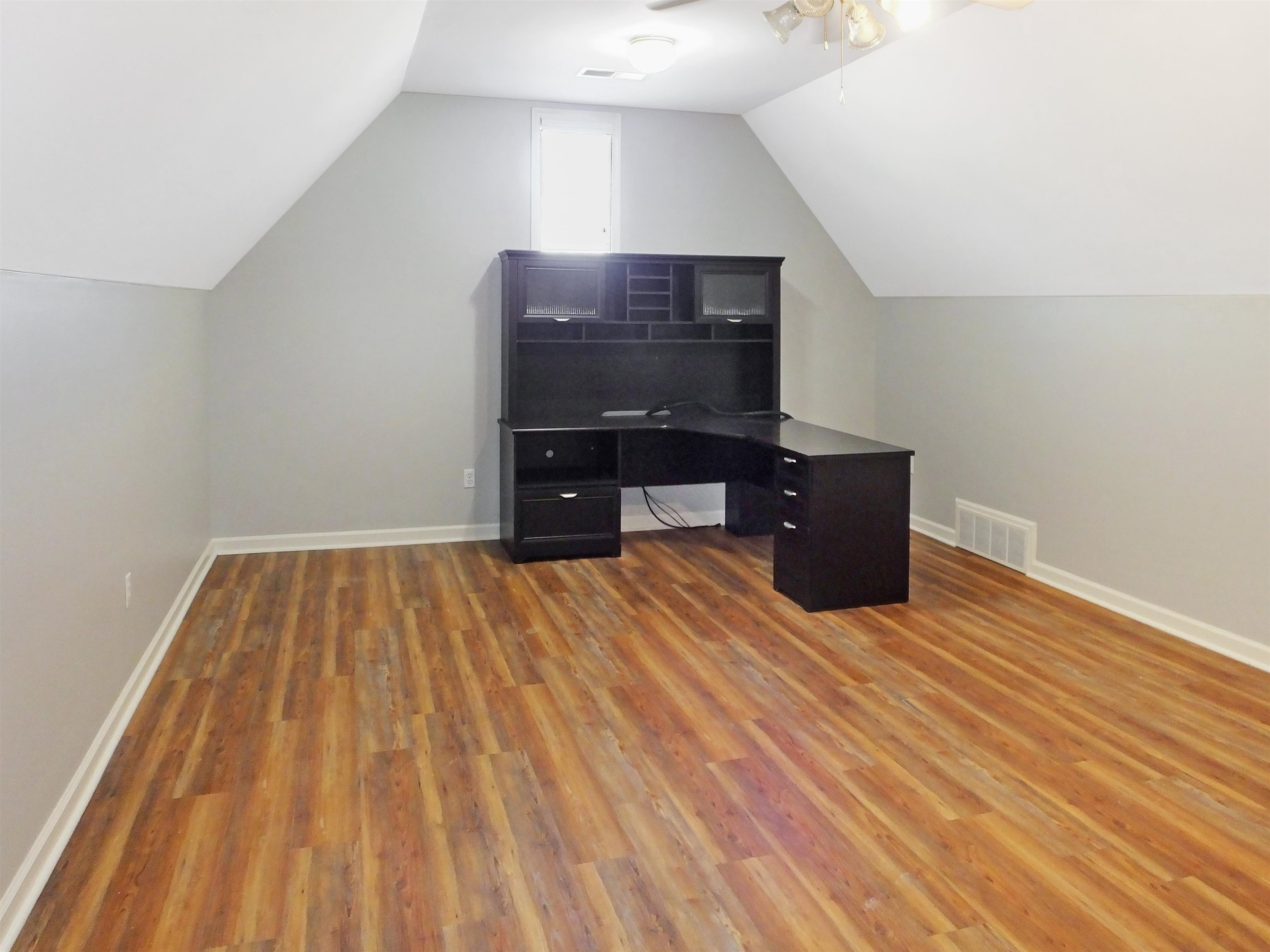 4323 Country Bridge Road Lakeland, TN 38002 - Photo 32 of 35 Unfurnished office featuring visible vents, lofted ceiling, a ceiling fan, wood finished floors, and baseboards