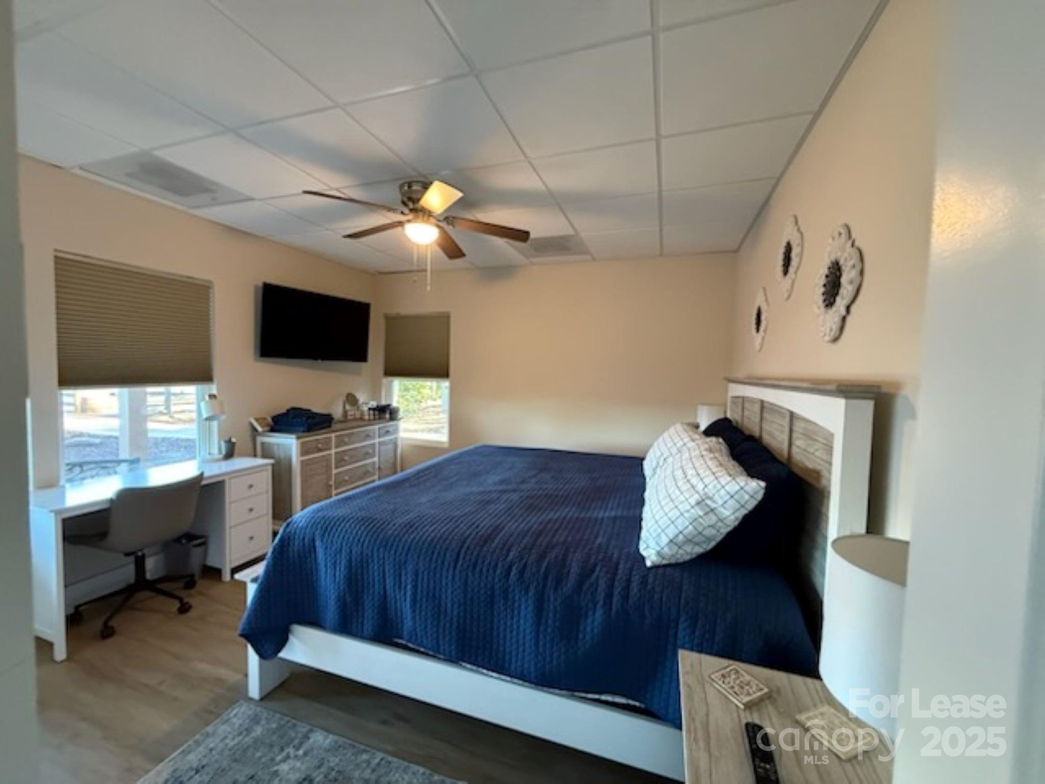 4897 Kiser Island Road, Unit A Terrell, NC 28682 - Photo 13 of 25 a bedroom with a bed and a flat tv screen on the dresser