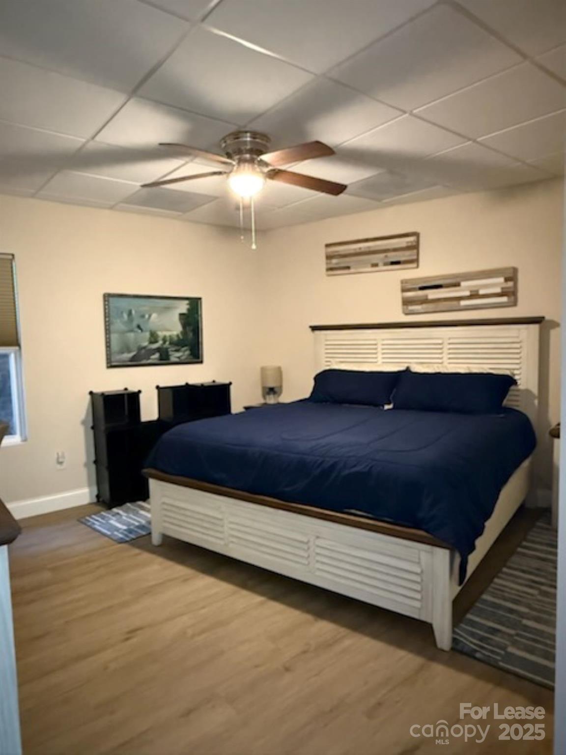 4897 Kiser Island Road, Unit A Terrell, NC 28682 - Photo 14 of 25 a spacious bedroom with a bed and ceiling fan