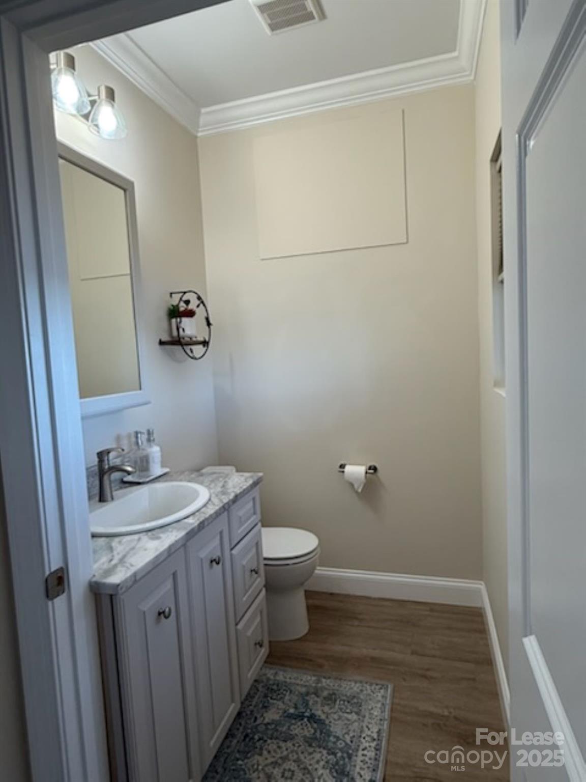 4897 Kiser Island Road, Unit A Terrell, NC 28682 - Photo 9 of 25 a bathroom with a sink a toilet and mirror
