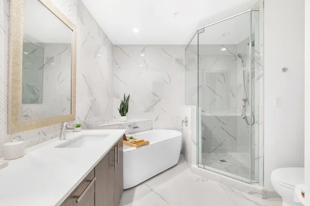 a bathroom with a bathtub and a sink