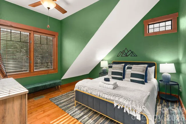 a bedroom with furniture and a window