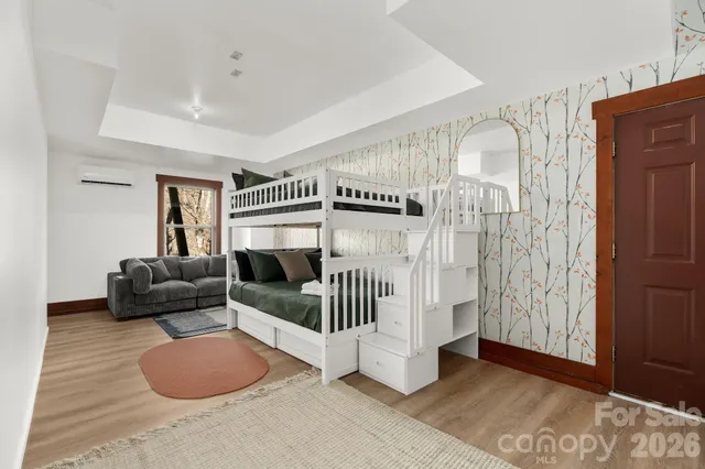 a bed room with a bed and a chandelier