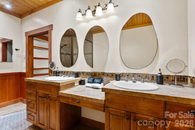 a bathroom with a toilet sink and shower