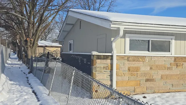 a view of a house with a bench