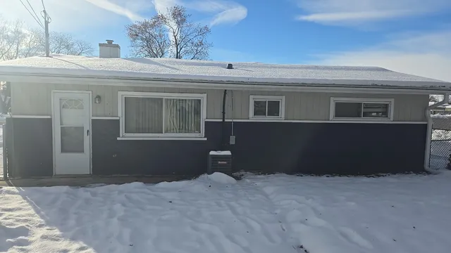 an empty room with a wooden door