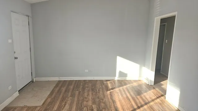 a kitchen with a refrigerator stove and white cabinets