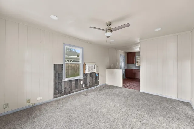 a view of a kitchen with a sink and a refrigerator