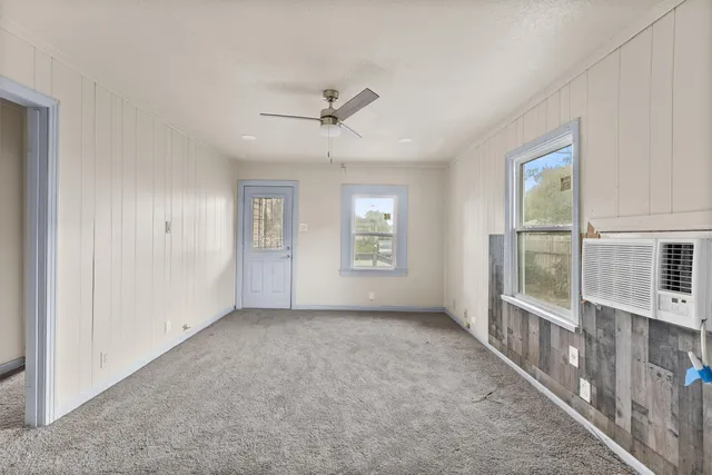 a view of an empty room with a window