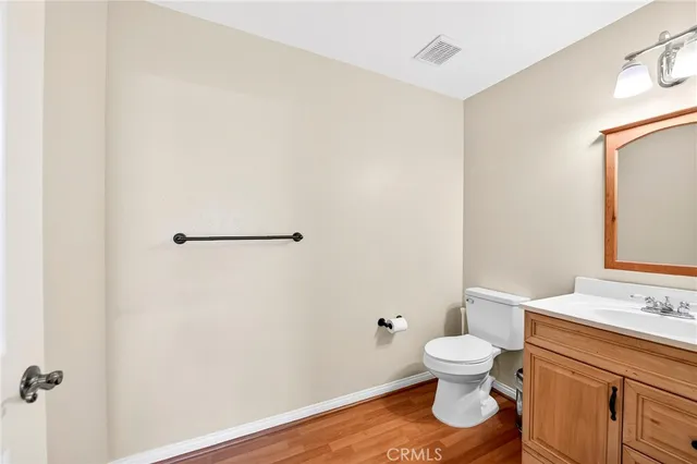 a bathroom with a toilet a sink and view