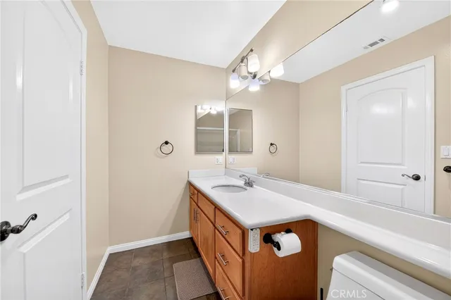 a bathroom with a sink a mirror and a shower