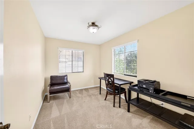 a workspace with furniture and a window