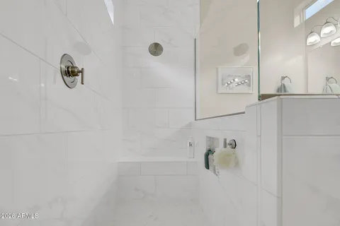 a bathroom with a granite countertop sink a toilet and a bathtub