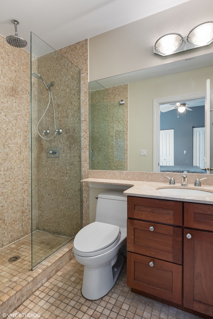 3522 North Racine Avenue, Unit 1N Chicago, IL 60657 - Photo 11 of 17 a bathroom with a sink a toilet and shower