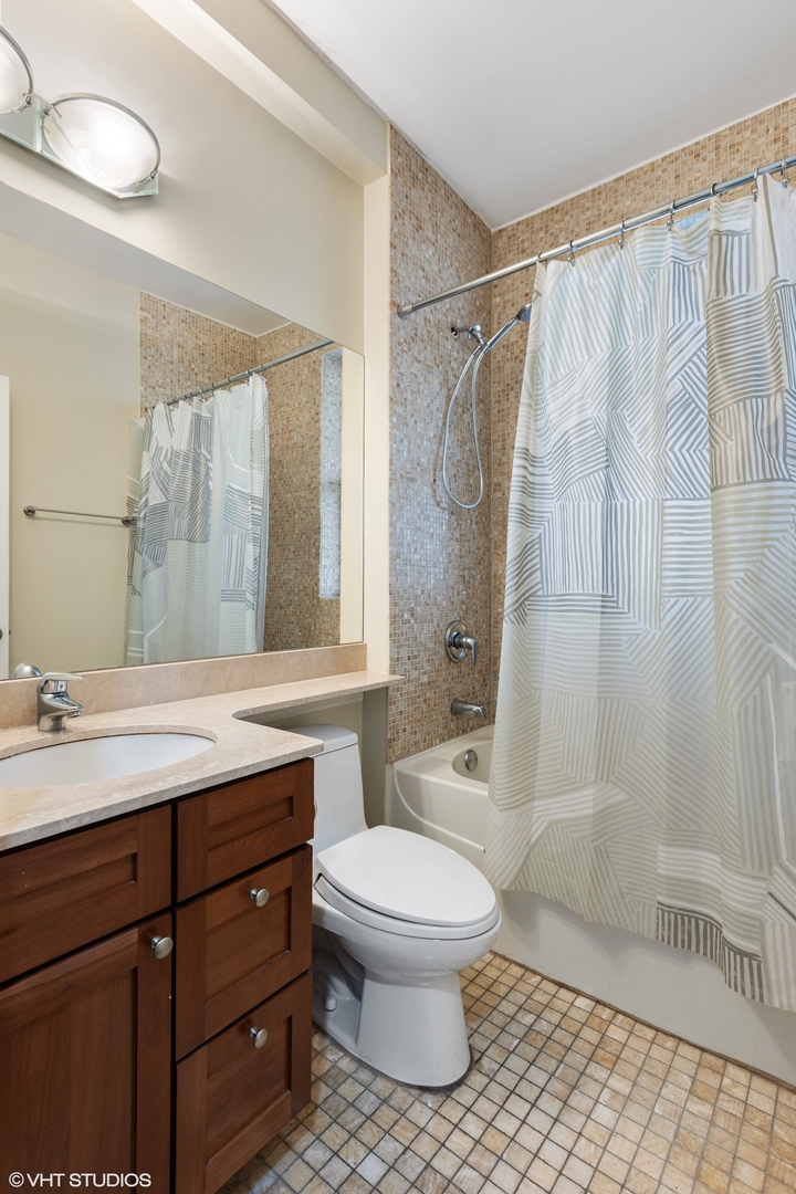 3522 North Racine Avenue, Unit 1N Chicago, IL 60657 - Photo 9 of 17 a bathroom with a sink a toilet and shower