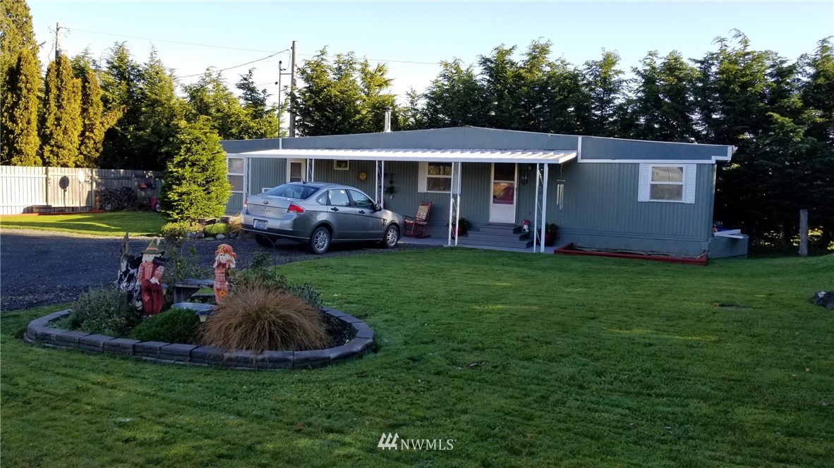 171 Spath Road Sequim, WA 98382 - Photo 2 of 21 a view of a house with a yard and sitting area