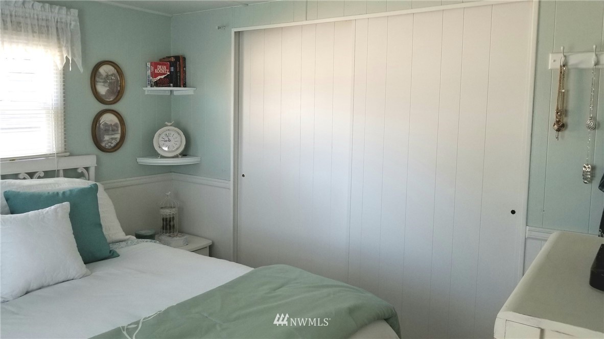 171 Spath Road Sequim, WA 98382 - Photo 14 of 21 a bedroom with a bed and a window