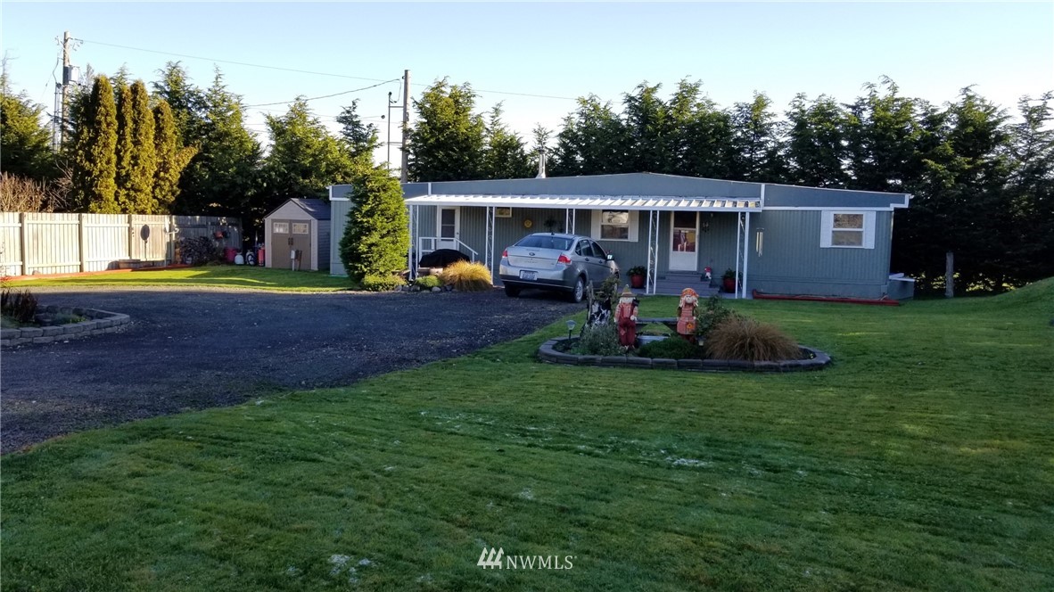 171 Spath Road Sequim, WA 98382 - Photo 20 of 21 a view of a house with backyard and a tree
