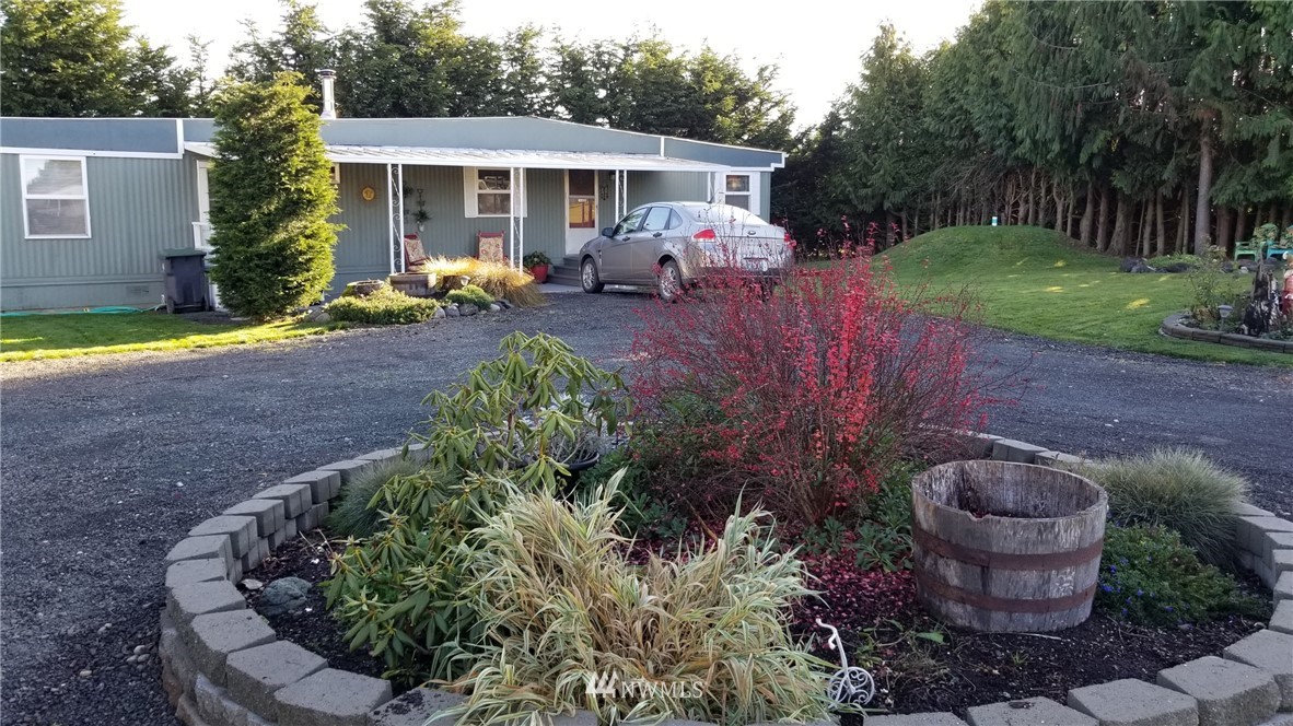 171 Spath Road Sequim, WA 98382 - Photo 21 of 21 a front view of a house with garden