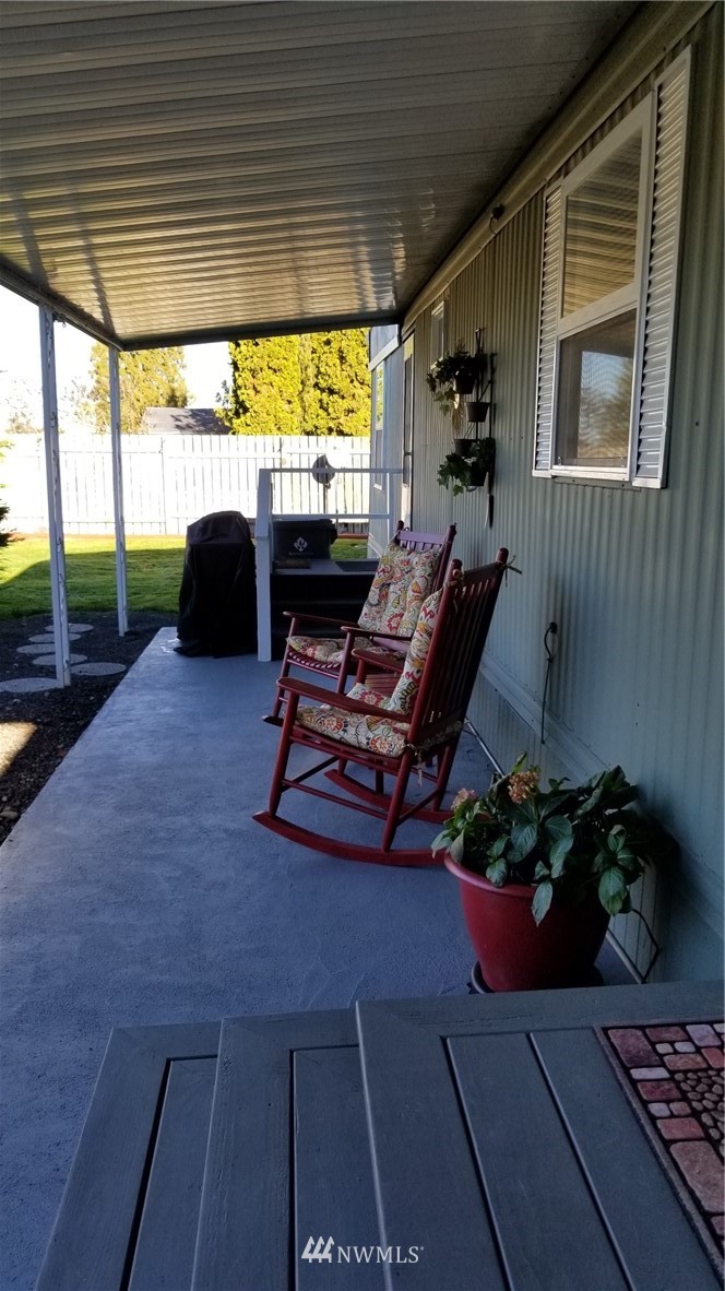 171 Spath Road Sequim, WA 98382 - Photo 4 of 21 a view of a porch with furniture and a potted plant