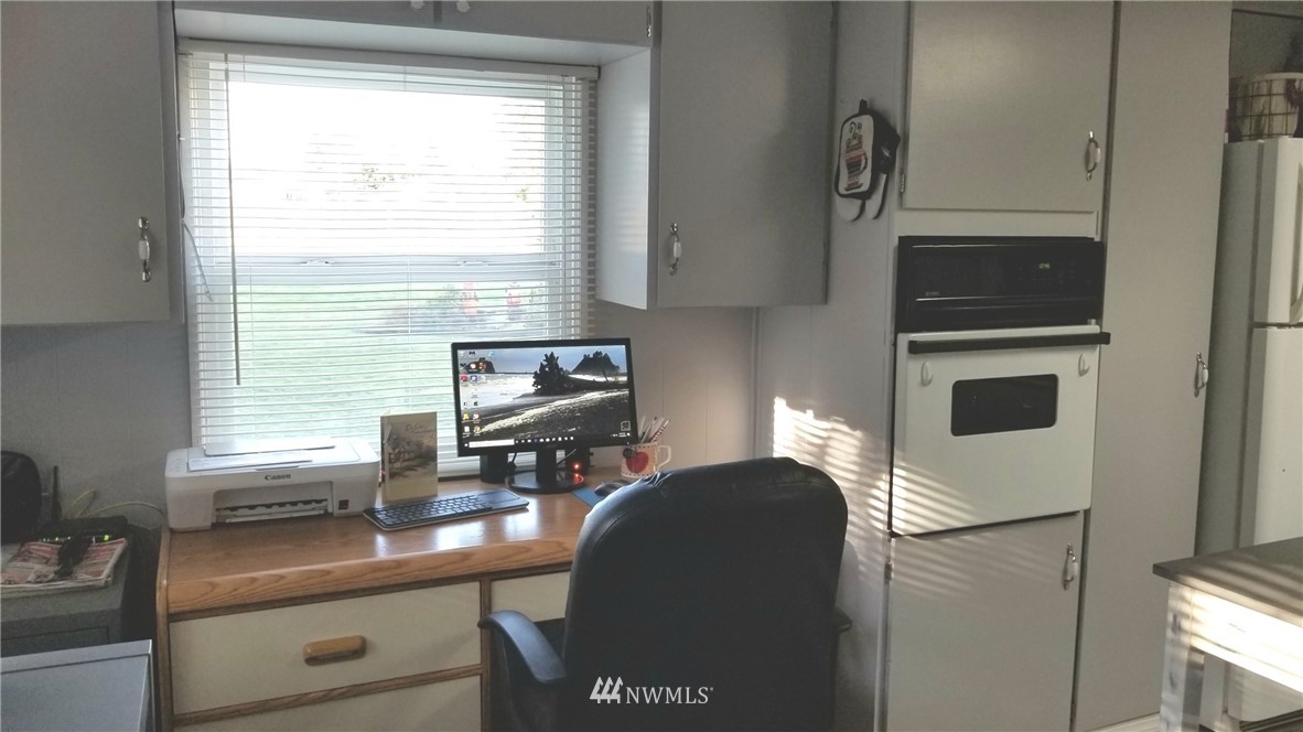 171 Spath Road Sequim, WA 98382 - Photo 9 of 21 a view of a workspace with furniture and a window