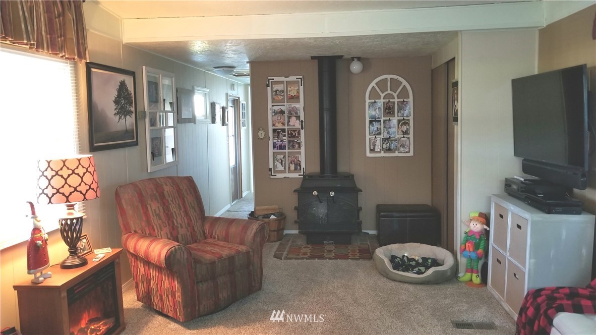 171 Spath Road Sequim, WA 98382 - Photo 10 of 21 a living room with furniture and a flat screen tv