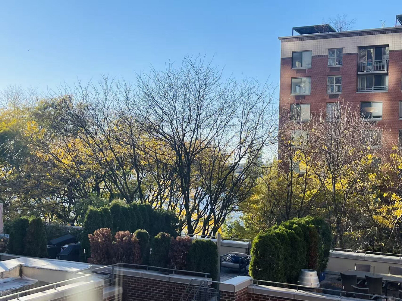 2 South End Avenue, Unit 5T Manhattan, NY 10280 - Photo 1 of 9 a view of a brick building next to a road